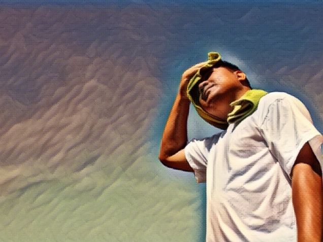 young man under the sun and experiencing heat exhaustion
