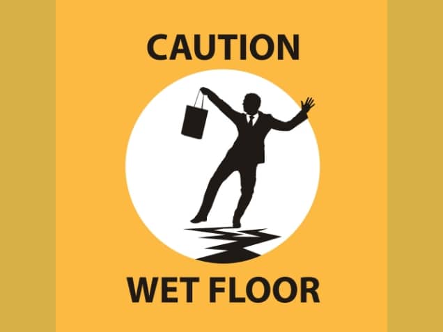 Caution wet floor sign in yellow background. concept of Slip and Fall in a Restaurant