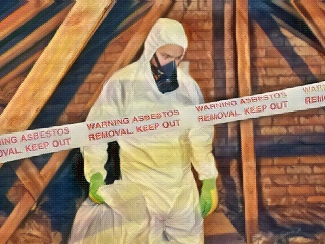 A worker wearing protective clothing while clearing asbestos