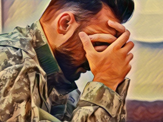 side view of depressed army man in military uniform with post-traumatic stress disorder