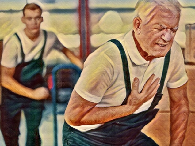 Senior warehouseman having a heart attack at work