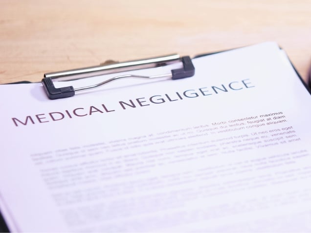 Medical negligence document on a clipboard