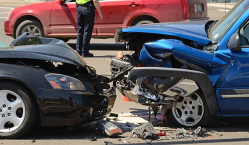 Head on collision between two cars.