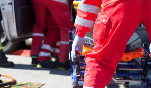 Paramedics holding a stretcher.