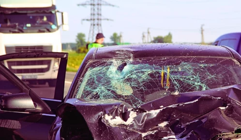 Car after a head on crash accident with a truck.