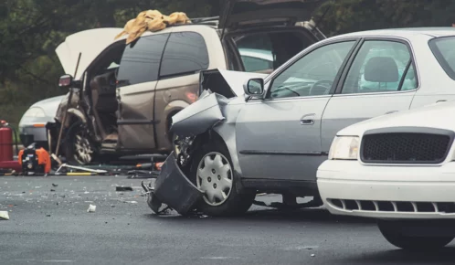 Multiple vehicle car crash along the highway.