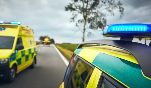 Two ambulance and a helicopter to rescue an injured person.