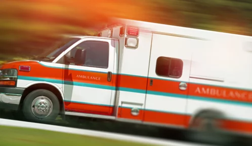 Speeding ambulance going to hospital.
