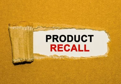 The text Product Recall appearing behind torn brown paper.