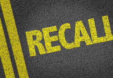 Yellow painted recall on the concrete.