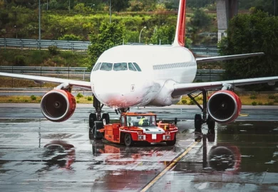 Plane at a airport terminal building.