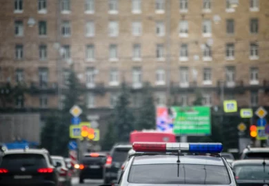 Police car in the middle of the road.