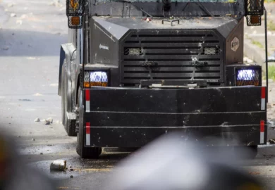 Black semi truck on the road.