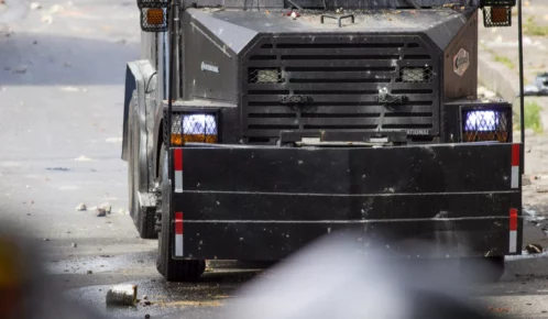 Black semi truck on the road.