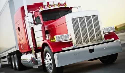 Semi truck hauling cargo down the road with motion blur. trucking accidents on I-90