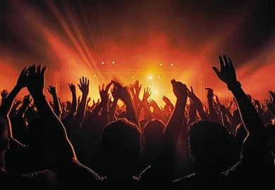 Silhouette of people in a music concert. Holding Music Venues Accountable