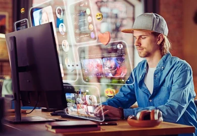 Young Handsome Man Using Desktop Computer To Check Social Media.