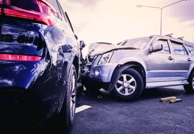 Car crash dangerous accident on the road. SUV car crashing beside another one on the road.