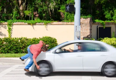 Guy got hit by a car with inattentive driver.