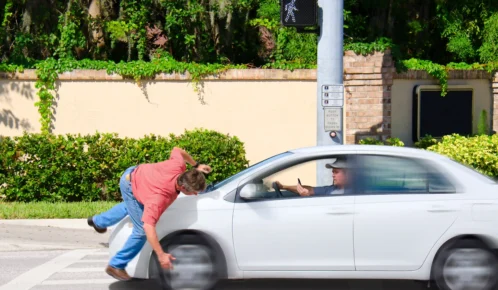 Guy got hit by a car with inattentive driver.