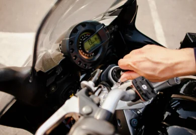 Man turning the engine of his motorcycle.