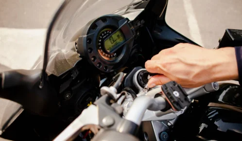 Man turning the engine of his motorcycle.