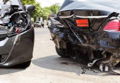 Fatal car crash between two black sedan cars.