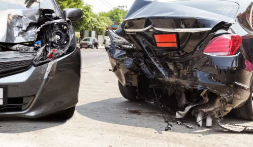 Fatal car crash between two black sedan cars.