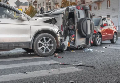 Multiple car crash in the middle of the road.