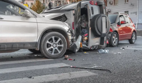 Multiple car crash in the middle of the road.