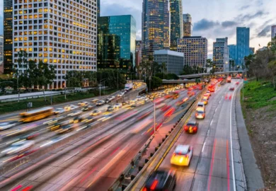 Multiple vehicles passing through a highway.