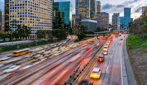 Multiple vehicles passing through a highway.