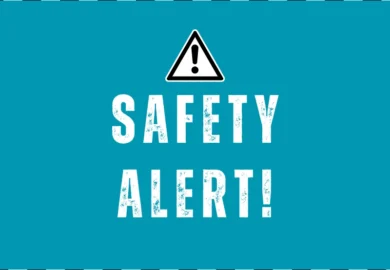 Blue "Safety Alert!" sign with hazard warning icon.