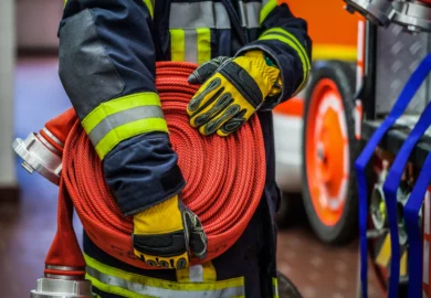 A firefighter holding a water hose.