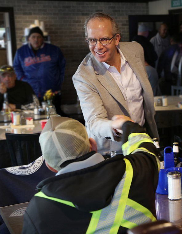 Howard Ankin greets local worker on International Workers Day.